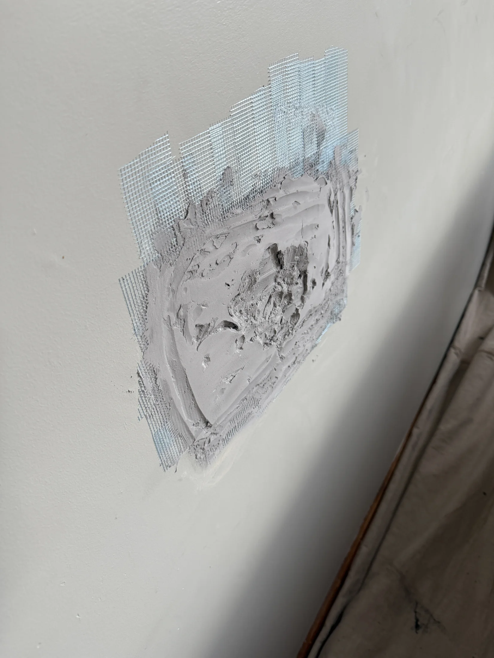 DIY wall patch attempt — compound over mesh tape