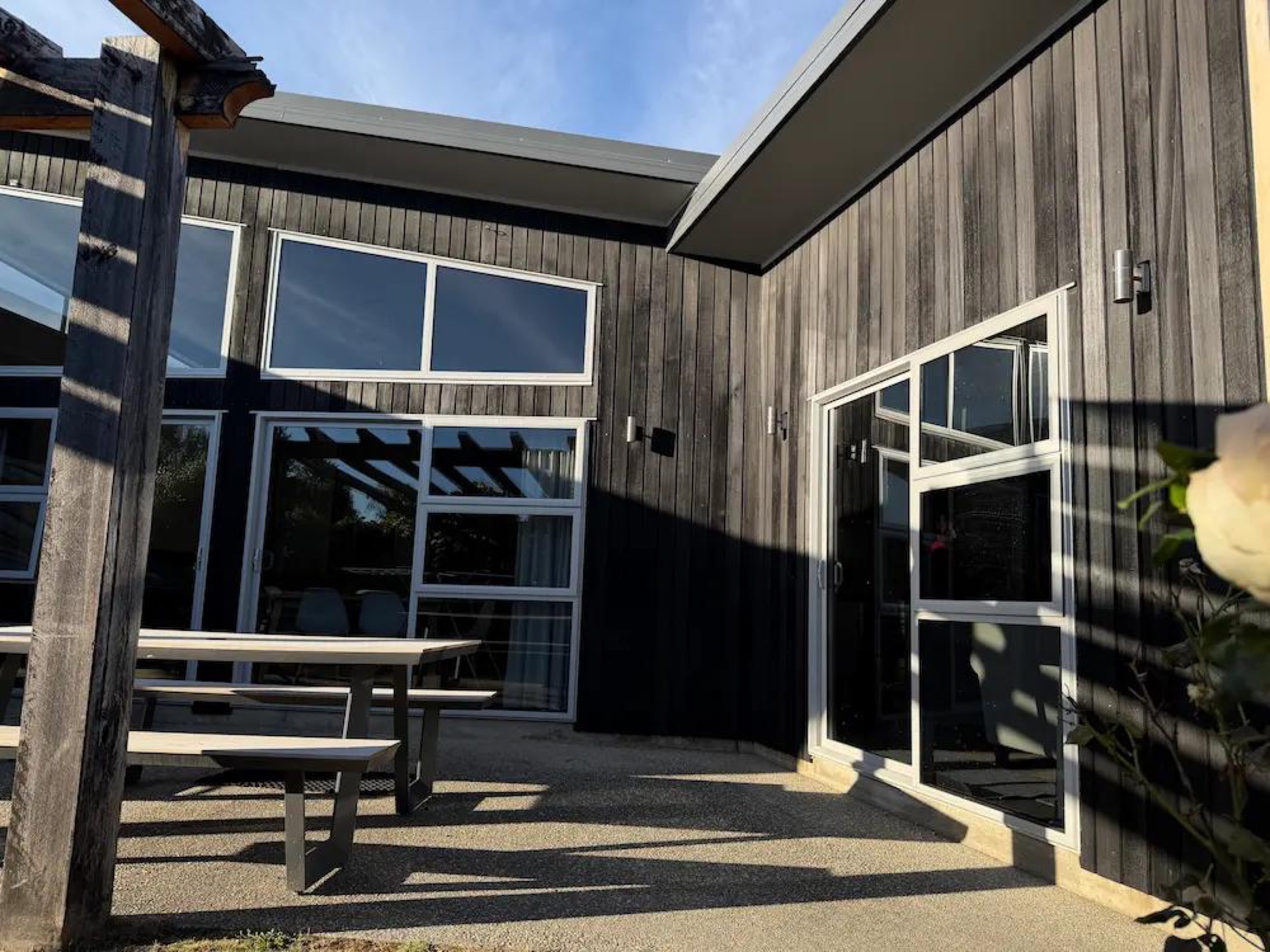 Cedar Exterior Restoration and Stain Refresh in Wānaka - After 3: Restored Cedar Cladding Rear Patio Albert Town