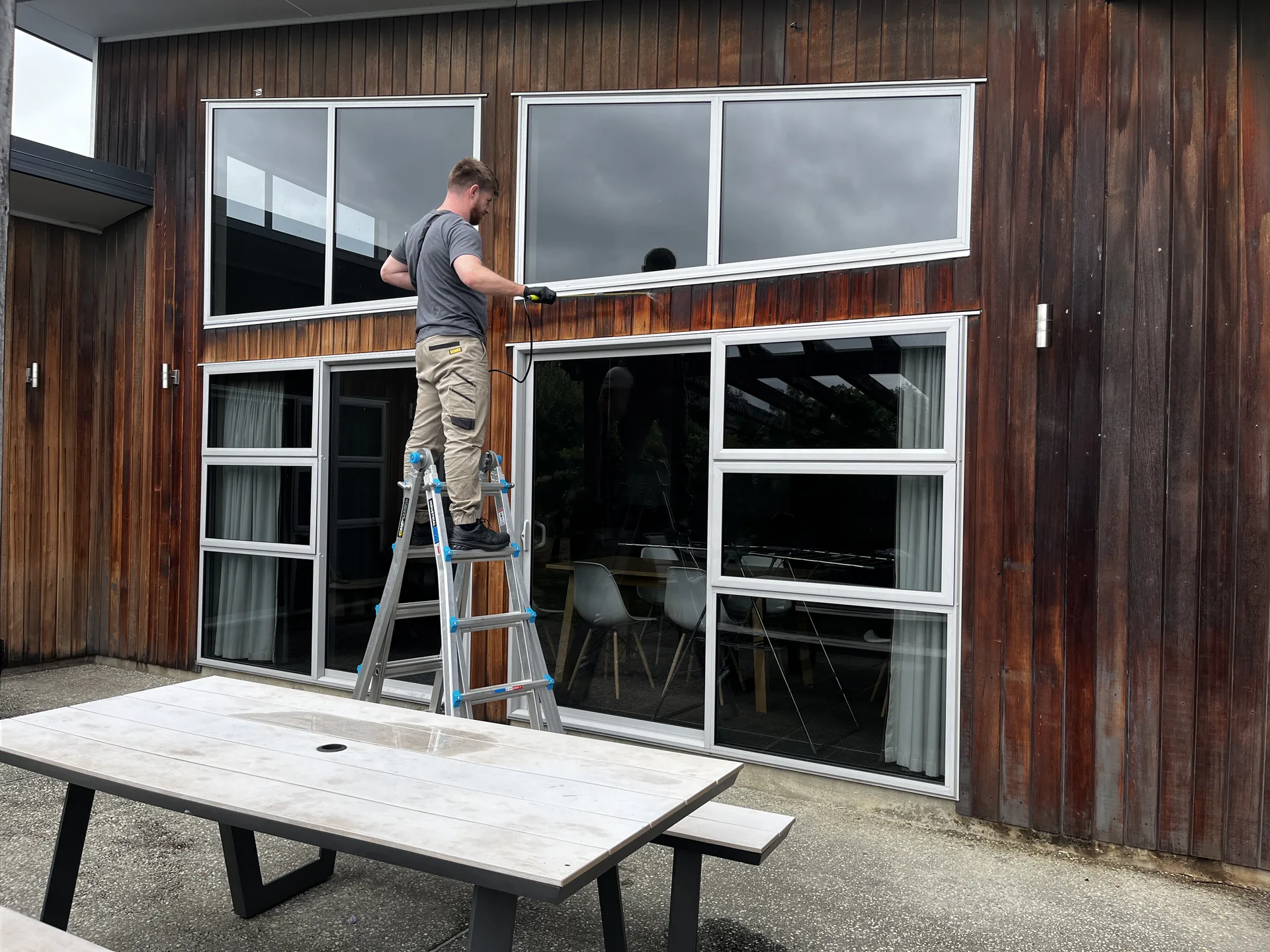 Cedar Exterior Restoration and Stain Refresh in Wānaka - Process 6: Masking Windows Cedar Exterior Preparation Wanaka