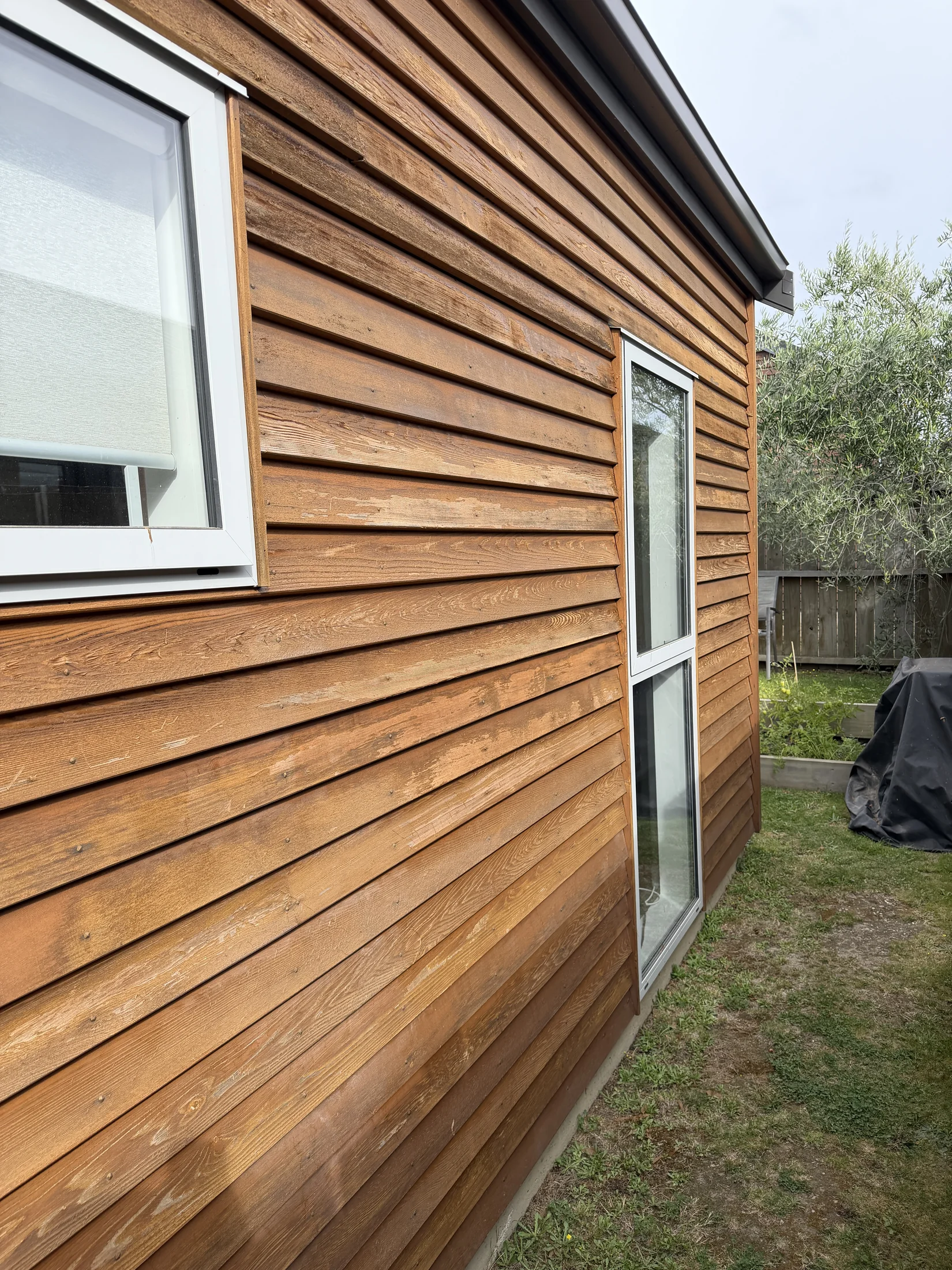 Cedar Maintenance in Northlake, Wānaka - Before 3: Weathered Cedar Cladding Failed Stain Side Elevation Northlake Wanaka