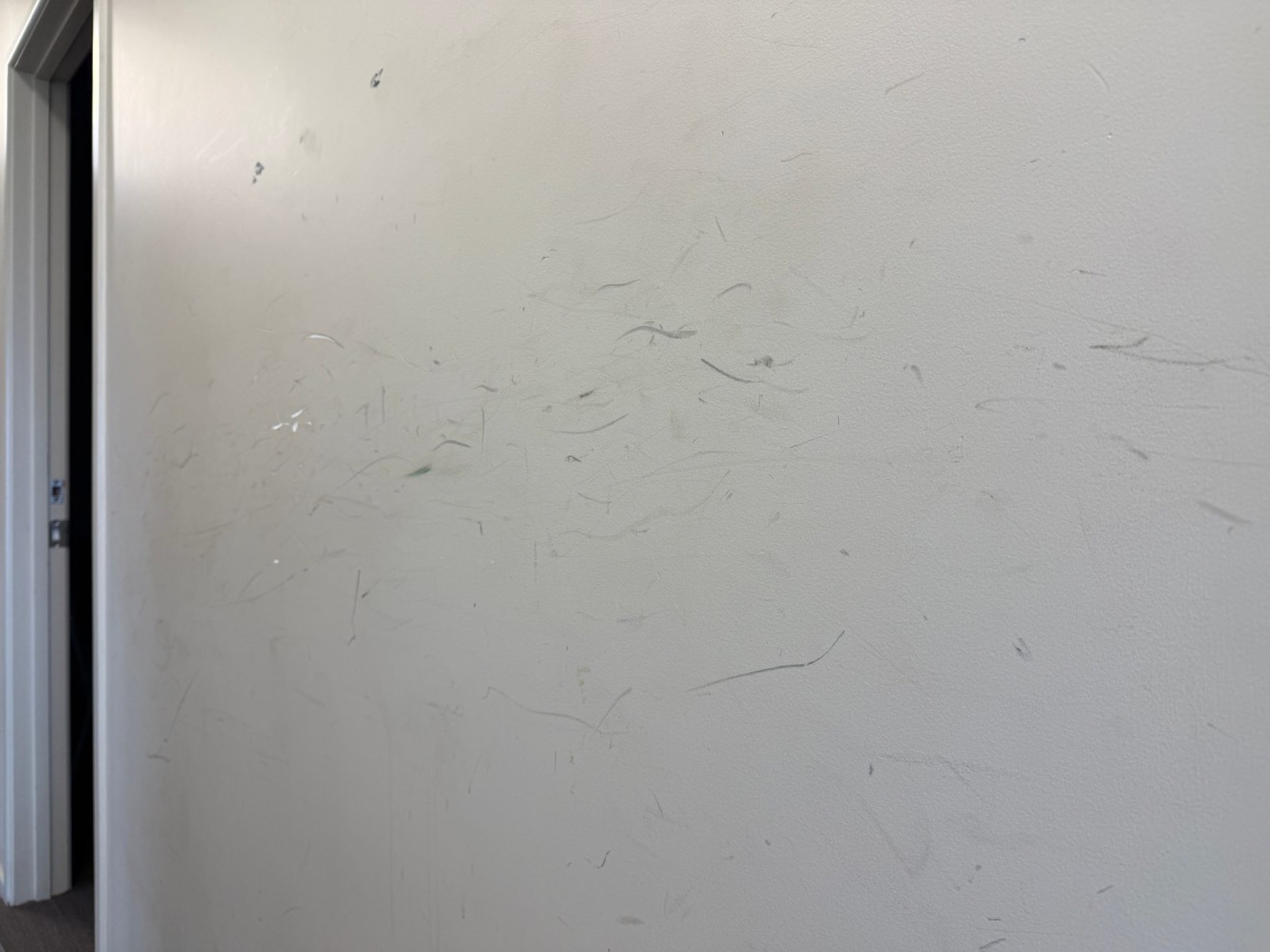 Weatherboard exterior wall showing surface marks and wear before painting preparation.