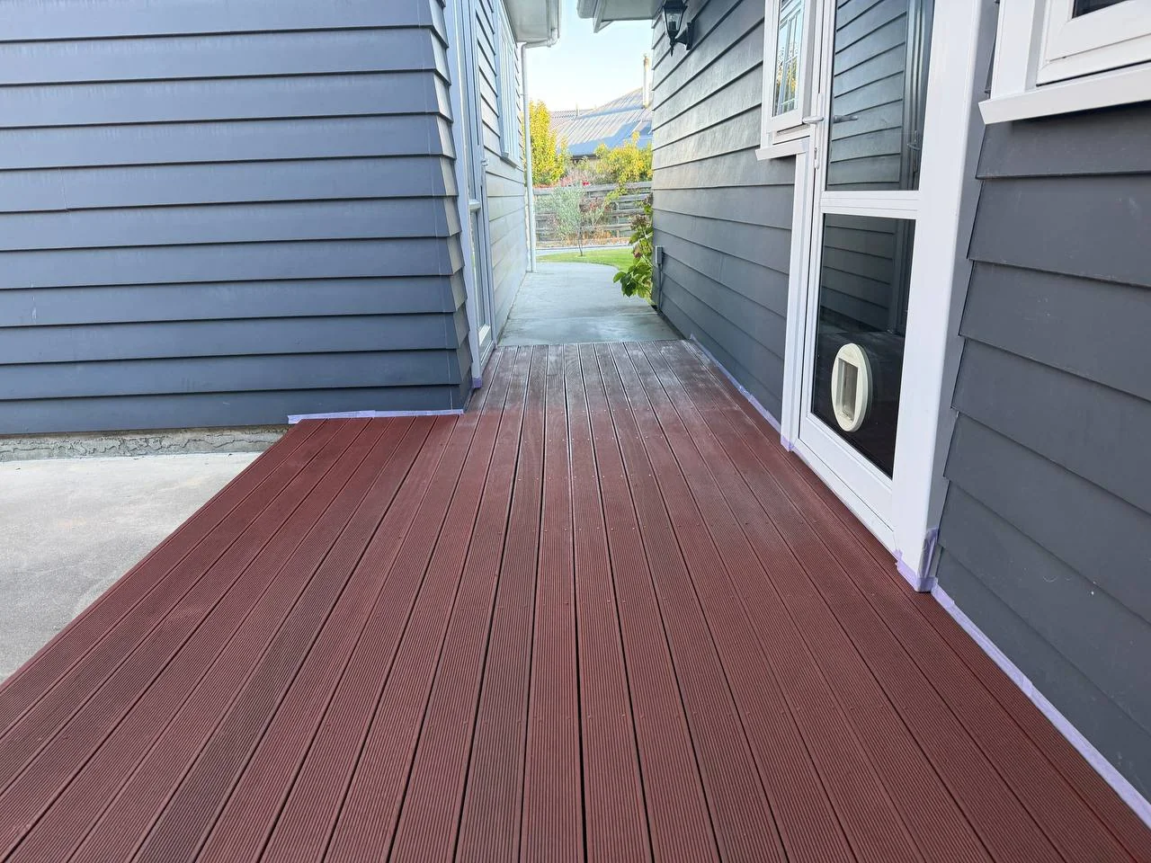 Exterior Repaint & Deck Stain, Albert Town - Process 4: Staining Deck Corridor Masking Tape Albert Town