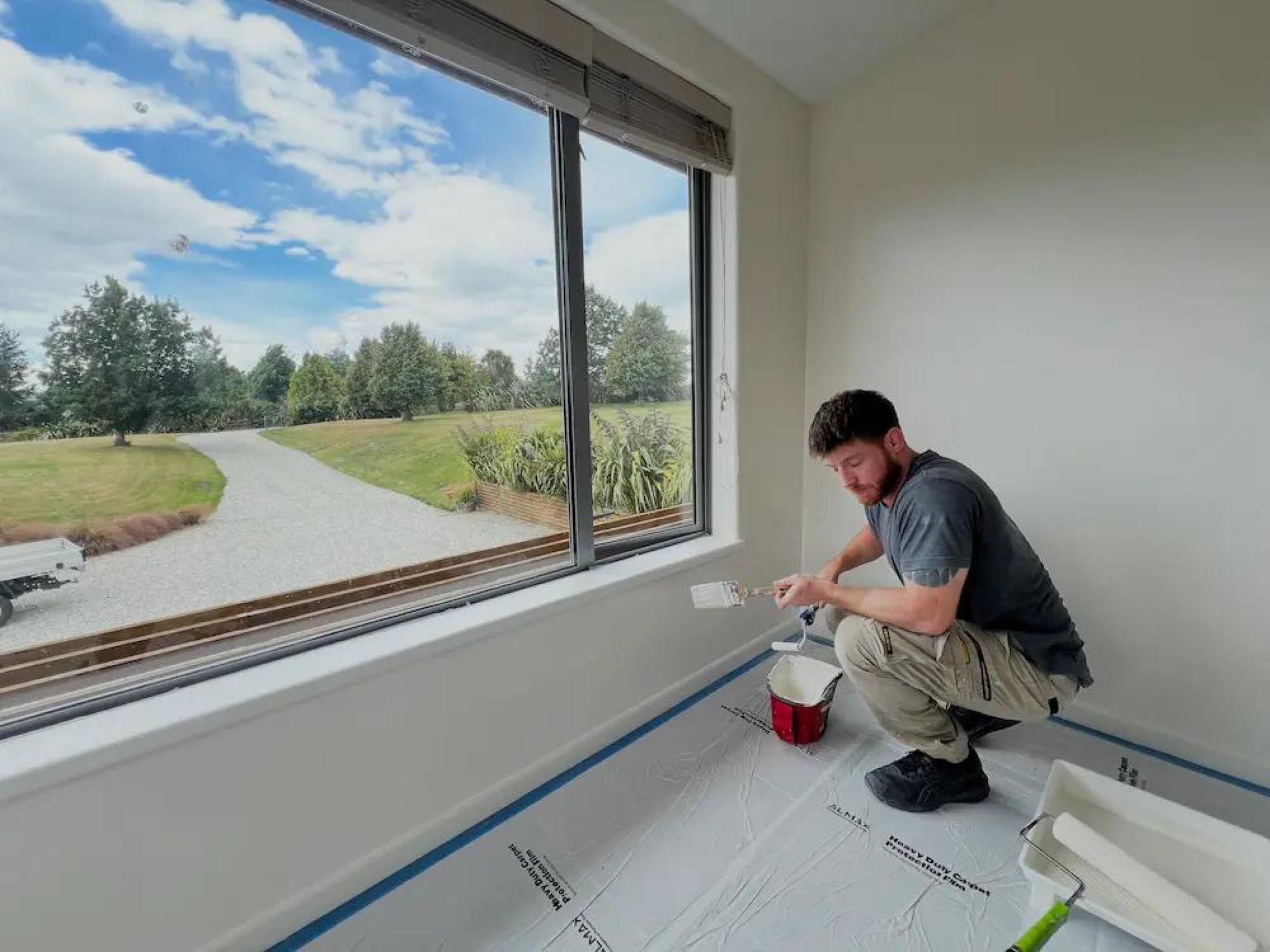 Flat Repaint in Wanaka - Process 4: Painter Cutting In Window Sill Wanaka