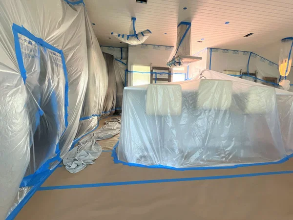 Room fully masked and covered before interior painting
